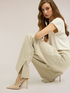 Pantaloni palazzo in punto milano gessato con spacco image number 3